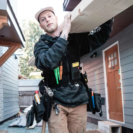 Worker installing overhead beam